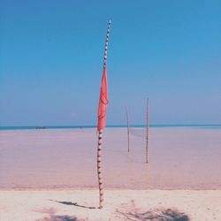 Lifeguard hut on beach against clear sky