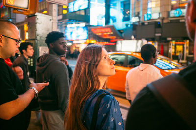 Woman standing in city