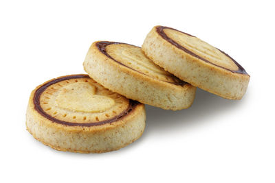 Close-up of cookies against white background