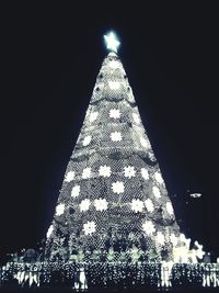 Low angle view of illuminated lights at night