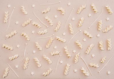 High angle view of arrow sign on white surface