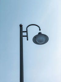 Low angle view of street light against sky