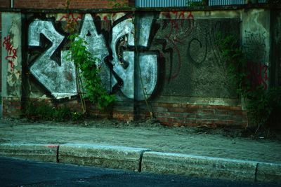 Close-up of graffiti on abandoned building