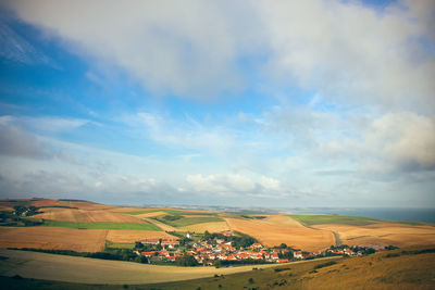 Scenic view of agricultural field against sky