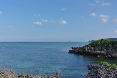 Scenic view of sea against blue sky