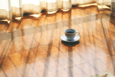 High angle view of coffee cup on table