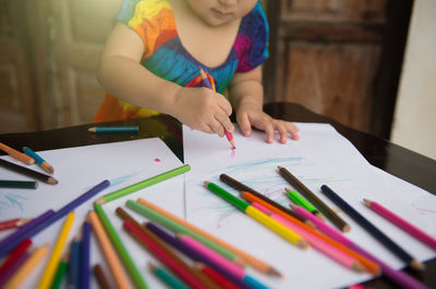 Full length of multi colored pencils on table