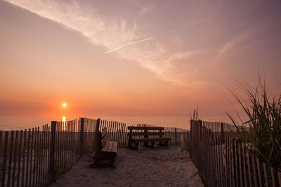 Scenic view of beach against sky during sunset