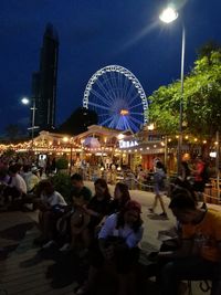 People enjoying at amusement park