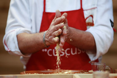 Close-up of man preparing food