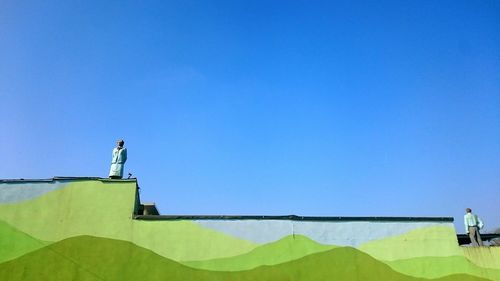 Low angle view of built structure against clear blue sky