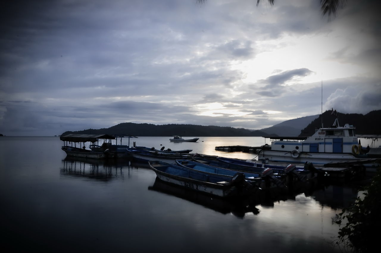 BOATS MOORED AT SEA