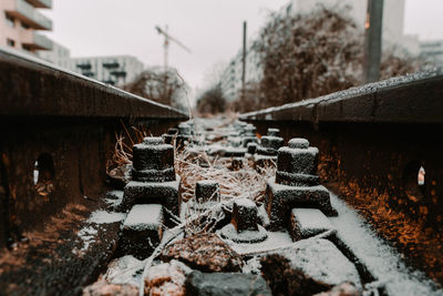 Surface level of snow covered bridge in city