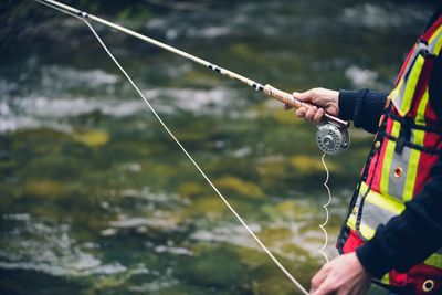 Person holding fishing rod