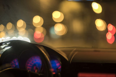 Close-up of illuminated speedometer at night