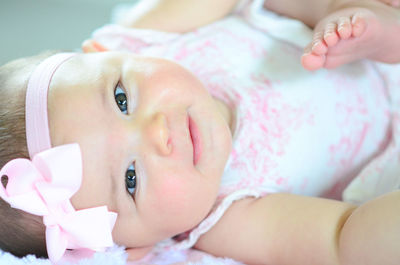 Close-up of cute girl sleeping at home