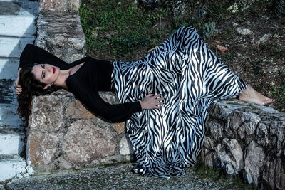 Full length of woman lying down outdoors