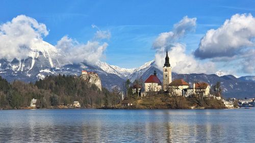 Panoramic view of sea and mountains against sky