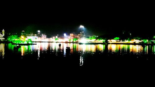 Reflection of illuminated buildings in water