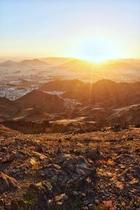 Aerial view of landscape against sky during sunset