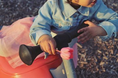 High angle view of boy playing with toy