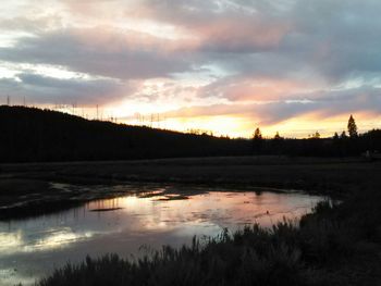 Scenic view of lake at sunset