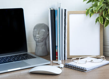 Office desktop. laptop with office supplies on the table.