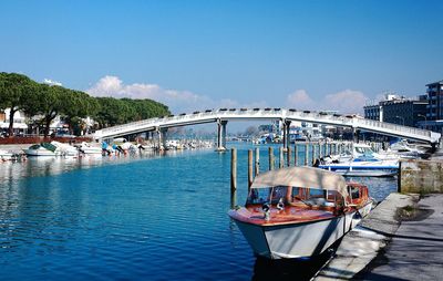 Boats moored at harbor