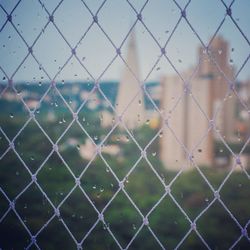 Full frame shot of chainlink fence against sky