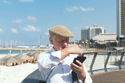 Man using mobile phone in water