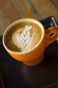 Close-up of cappuccino on table