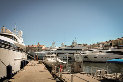 Boats moored at harbor