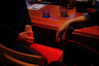 High angle view of people sitting on table