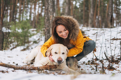 Portrait of dog on snow covered land