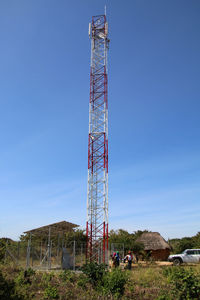 Low angle view of electricity pylon against clear sky