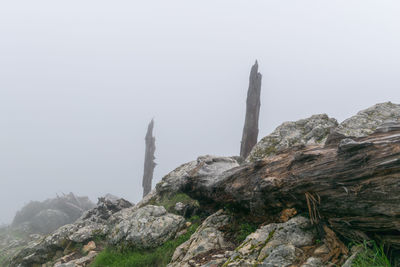 Rock formations on mountain against sky