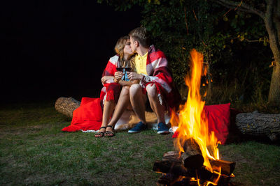 Group of people relaxing on grass