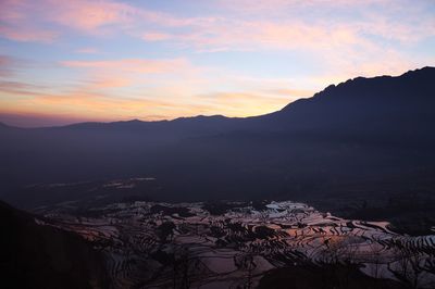 Scenic view of mountains against sky during sunset