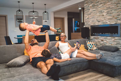 Side view of woman exercising at home