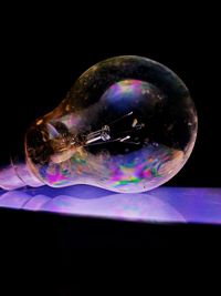 Close-up of bubbles over black background