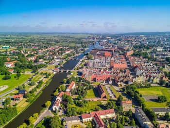 High angle view of buildings in city against sky