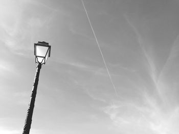 Low angle view of street light against sky