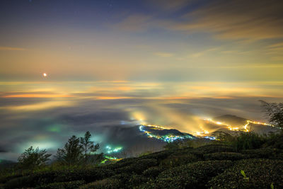 Scenic view of landscape against sky at night