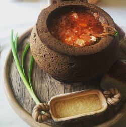 High angle view of borscht served in wooden tray