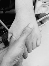 Close-up of couple holding hands