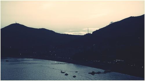 Scenic view of silhouette mountain against sky during sunset