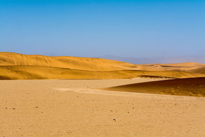 View of countryside landscape against blue sky