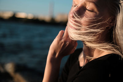 Close-up of woman with tousled hair