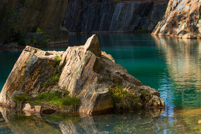 Scenic view of rock formation in lake