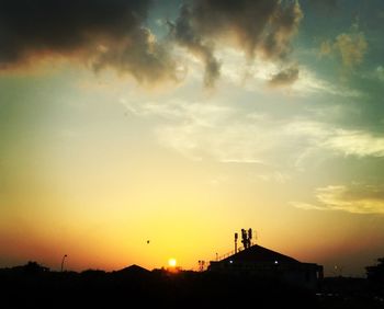 Silhouette of built structure at sunset